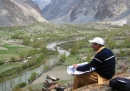 A community member undertakes mapping verification in a village in northern Pakistan, where a project to protect settlement from